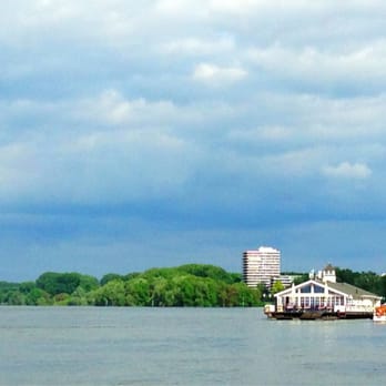 Wohnpark Rodenkirchen - Hochhaus Wohnpark Rodenkirchen am Rhein, Bootshaus Albatros im Vordergrund - Apartments Near Me - Cologne, NW Wohnpark Rodenkirchen - Hochhaus Wohnpark Rodenkirchen am Rhein, Bootshaus Albatros im Vordergrund - Apartments Near Me - Cologne, NW