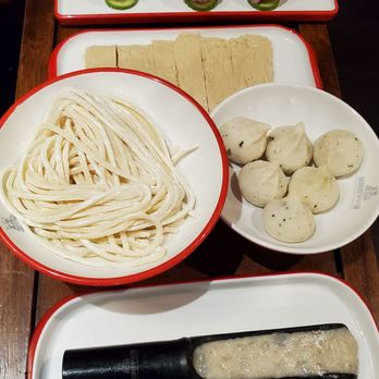Pipa Mountain Hot Pot - From top to bottom: meatballs, fried tofu skin, noodle, fish balls, shrimp paste - Hot Pot Near Me - Seattle, Washington