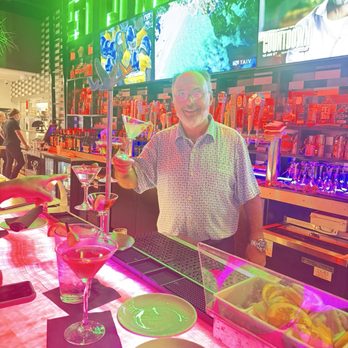 Stones Throw - Dave the Rave Restaurant Manager holding his martini tower - Steakhouses Near Me - Cape Coral, Florida Stones Throw - Dave the Rave Restaurant Manager holding his martini tower - Steakhouses Near Me - Cape Coral, Florida