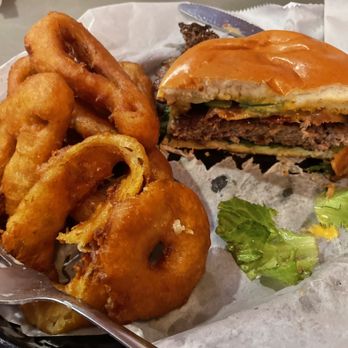 Two Roads Tavern - Onion rings and specialty burger (cheese, bacon, and jalapeños.) - Seafood Near Me - Kitty Hawk, North Carolina