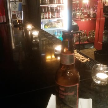 Quig's Pub - a bottle of beer on a table - Pubs Near Me - Philadelphia, Pennsylvania