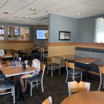 Culver's - two people sitting at a table in a restaurant - Ice Cream & Frozen Yogurt Near Me - Kissimmee, Florida