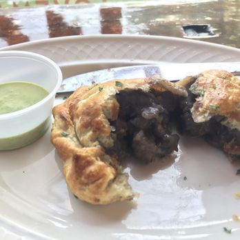 Empanola - Beef bourguignon- beef, onions, bacon, mushroom, and red wine & cilantro  and wine sauce - Empanadas Near Me - New Orleans, Louisiana