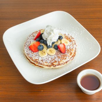 Pistachio Kitchen - Pistachio's Buttermilk Pancakes served with fresh fruit, whipped cream & powdered sugar. - Breakfast & Brunch Near Me - San Francisco, California Pistachio Kitchen - Pistachio's Buttermilk Pancakes served with fresh fruit, whipped cream & powdered sugar. - Breakfast & Brunch Near Me - San Francisco, California