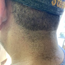 Hairbenders of Paia - Heather Green,  allowed my husband to leave their establishment looking like this. The top of his head looks worse.