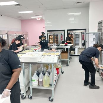 Crumbl - Pembroke - a group of people working in a kitchen - Bakeries Near Me - Virginia Beach, Virginia Crumbl - Pembroke - a group of people working in a kitchen - Bakeries Near Me - Virginia Beach, Virginia