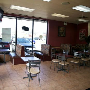 Babaz - the inside of a restaurant with tables and chairs - Middle Eastern Near Me - London, Ontario Babaz - the inside of a restaurant with tables and chairs - Middle Eastern Near Me - London, Ontario