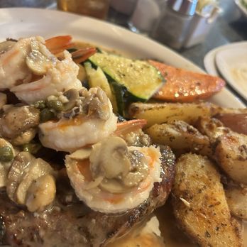 George's Bar & Grill - Rib Eye topped with some shrimp and mushrooms.. Let me not forget the red roasted potatoes..Mouth watering - Mediterranean Near Me - Fresno, California
