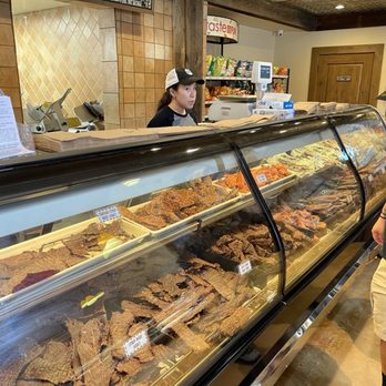 Dziuk Meat Market - a man standing in front of a deli counter - Meat Shops Near Me - Castroville, Texas Dziuk Meat Market - a man standing in front of a deli counter - Meat Shops Near Me - Castroville, Texas