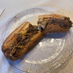 Cheesesteak with fried onions, mushrooms and Wiz. Cheesesteak with fried onions, mushrooms and Wiz.