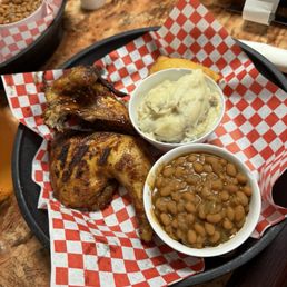 Half chicken dinner with garlic mash potatoes and baked beans Half chicken dinner with garlic mash potatoes and baked beans