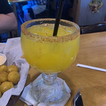 Texas Roadhouse - Mango margarita on the rocks with a tajin rim - American Near Me - Reno, Nevada Texas Roadhouse - Mango margarita on the rocks with a tajin rim - American Near Me - Reno, Nevada