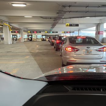 Hertz Rent A Car - Line of cars exiting the garage - Car Rental Near Me - Tampa, Florida Hertz Rent A Car - Line of cars exiting the garage - Car Rental Near Me - Tampa, Florida