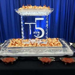Table of 5 Catering - Ice Sculpture for a recent event with extra jumbo southern spiced shrimp