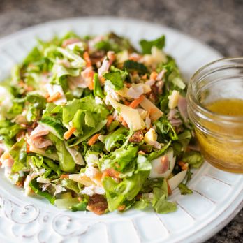 Twist Bakery & Cafe - a plate of salad with dressing - Gluten-Free Near Me - Millis, Massachusetts Twist Bakery & Cafe - a plate of salad with dressing - Gluten-Free Near Me - Millis, Massachusetts