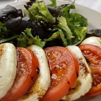 Rossellinis - Caprese al Fornio - fresh tomatoes & greens, with the mozzarella and balsamic oven baked (locking the sweetness in) - Italian Near Me - Daytona Beach, Florida
