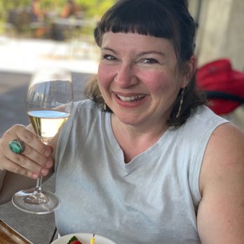 Gloria Ferrer Winery - Wine, lemon bar, smiling birthday girl - Wineries Near Me - Sonoma, California