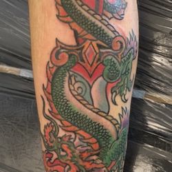 Lotus Tattoo - Drake tattoo sword