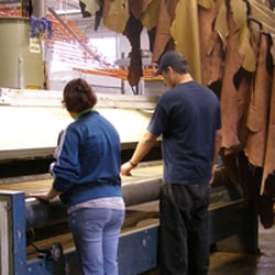 Danfield Leather & Design - One of the machines, with finished leather hanging