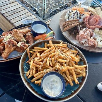 Flora Rooftop Bar - Wings with sweet and tangy Asian sauce, truffle fries, & charcuterie - Lounges Near Me - El Segundo, California Flora Rooftop Bar - Wings with sweet and tangy Asian sauce, truffle fries, & charcuterie - Lounges Near Me - El Segundo, California