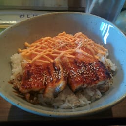 Don buri with spicy salmon and eel. Already consumed the side salad that came with it.