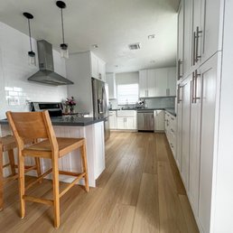 a kitchen with hardwood floors a kitchen with hardwood floors