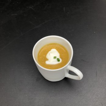 Handheld Catering and Events - Curried winter squash soup sip appetizer. - Caterers Near Me Handheld Catering and Events - Curried winter squash soup sip appetizer. - Caterers Near Me