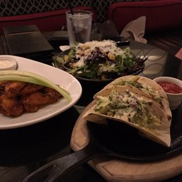 Organic greens, buffalo wings and fish tacos Organic greens, buffalo wings and fish tacos