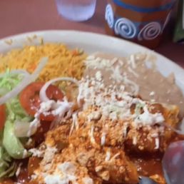 Red cheese enchiladas with beans and rice. And a modelo michilada. Red cheese enchiladas with beans and rice. And a modelo michilada.