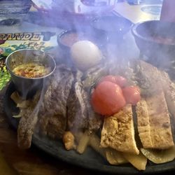 El Rancho Grande - Sizzling beef and chicken fajitas. 06/2025