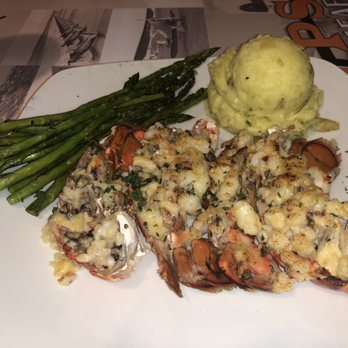 Props - Two lobster tails cooked thermidor style with mashed potatoes and grilled asparagus. - Seafood Near Me - Warner Robins, Georgia