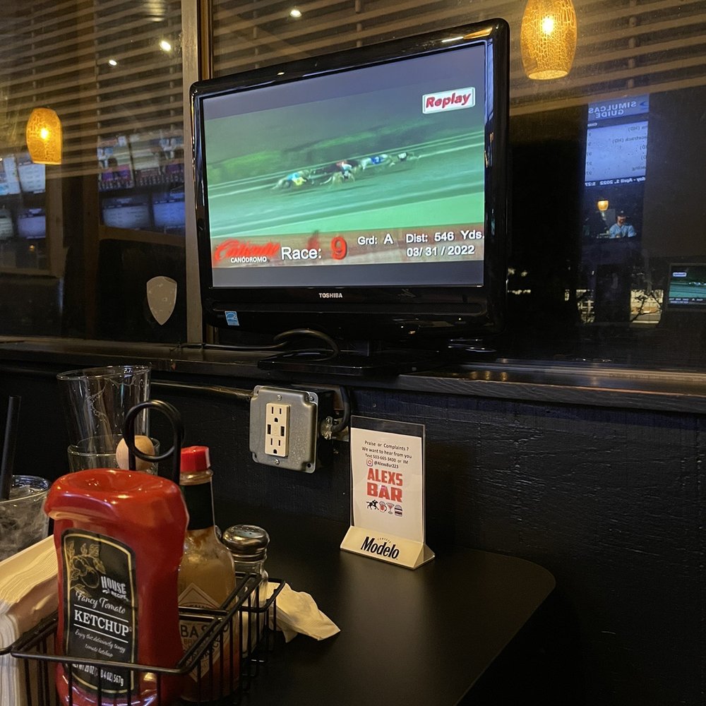 Alexs Bar - Every table has a TV, USB port and electrical outlet - Sports Bars Near Me - Fairview, Oregon