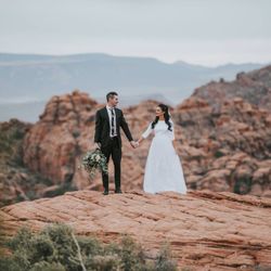 What a beautiful couple and view! We are so glad we can be a part of Savannah and Vance's special day! Schedule a fitting today!