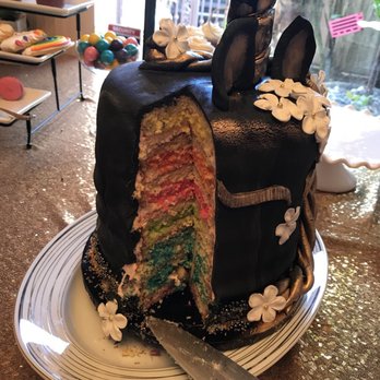 Babicakes - a cake with a slice taken out of it - Desserts Near Me Babicakes - a cake with a slice taken out of it - Desserts Near Me