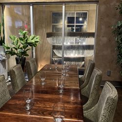 Paliotti's Italian Kitchen & Bar - Upstairs section for large parties with large window facing beautiful chandelier