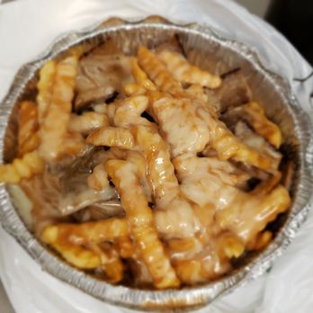 Simply Donairs - a pan of food on a table - Donairs Near Me - Edmonton, Alberta