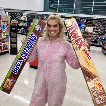 Walgreens - a woman in a pink bunny suit holding two candy bars - Drugstores Near Me - Blaine, Minnesota Walgreens - a woman in a pink bunny suit holding two candy bars - Drugstores Near Me - Blaine, Minnesota