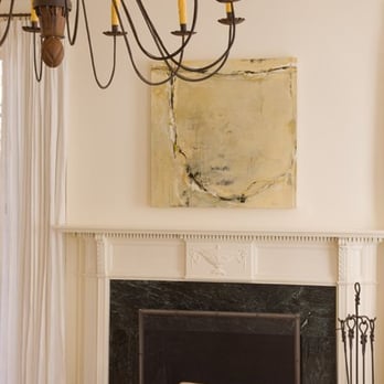 Texas Construction Company - a living room with a fireplace and chandelier - General Contractors Near Me - Austin, Texas Texas Construction Company - a living room with a fireplace and chandelier - General Contractors Near Me - Austin, Texas