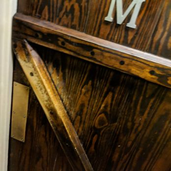 Clay Pit - Men's bathroom door. I like the wood look. - Indian Near Me - Austin, Texas