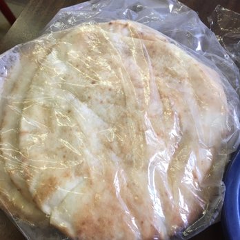 Shawarma Time Restaurant - a flat bread wrapped in plastic - Halal Near Me - Winnipeg, Manitoba