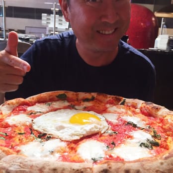 Centonove - Margherita pizza with a farm egg, oh! And my Hubby pointing at it. - Italian Near Me - Los Gatos, California