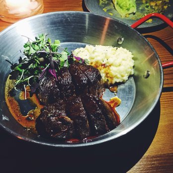 Thursday Kitchen - The chewy tough steak with an amazing sauce, micro greens, and super yum (i think) grits - Korean Near Me - New York, New York