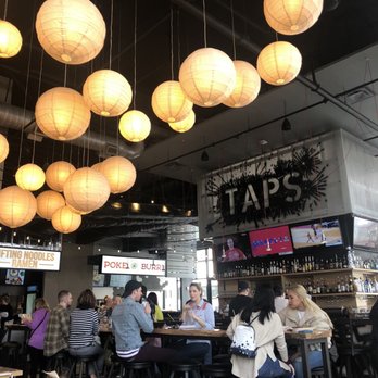 Taps At Ph'east - a group of people sitting at a bar - Beer Bar Near Me - Atlanta, Georgia