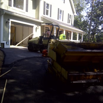 Sealrite Asphalt Maintenance - a man working on a driveway - General Contractors Near Me - Worcester, Massachusetts Sealrite Asphalt Maintenance - a man working on a driveway - General Contractors Near Me - Worcester, Massachusetts