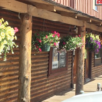 Prospect Store - a storefront with hanging baskets of flowers - Grocery Near Me - Prospect, Oregon