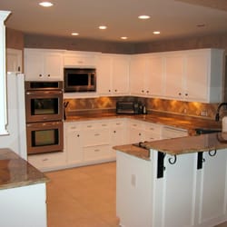 Kitchen Remodel After- Removed cabinet furdowns, glazed kitchen cabinets, venetian plaster, granite countertops, backsplash