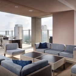SkyHouse River Oaks Apartments - Rooftop comfortable seating, TVs and billiards table