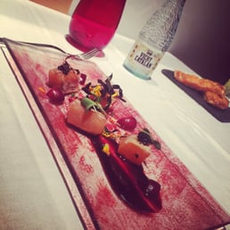 Lightly smoked salmon with mujjol caviar, seaweed spaghetti, and cherry cream.