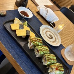 Phoenix Express - 2 pieces of egg sushi (Tamago) and a Dragon Roll (Eel, cucumber, and Avocado)