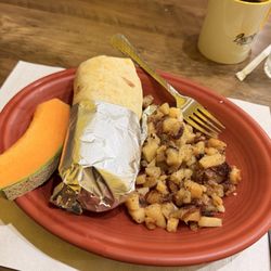 Buenos Dias - Chorizo breakfast burrito: A generously sized burrito, potatoes: cantaloupe:
